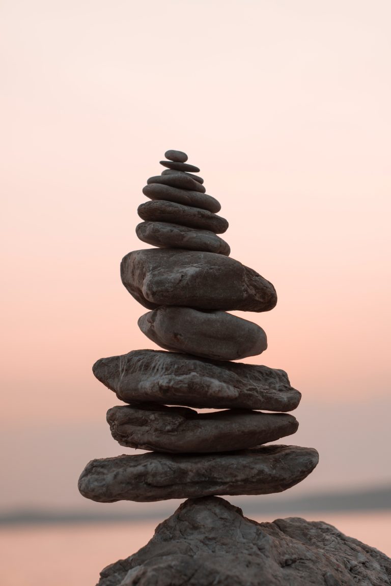 Flat grey rocks balanced on top of each other